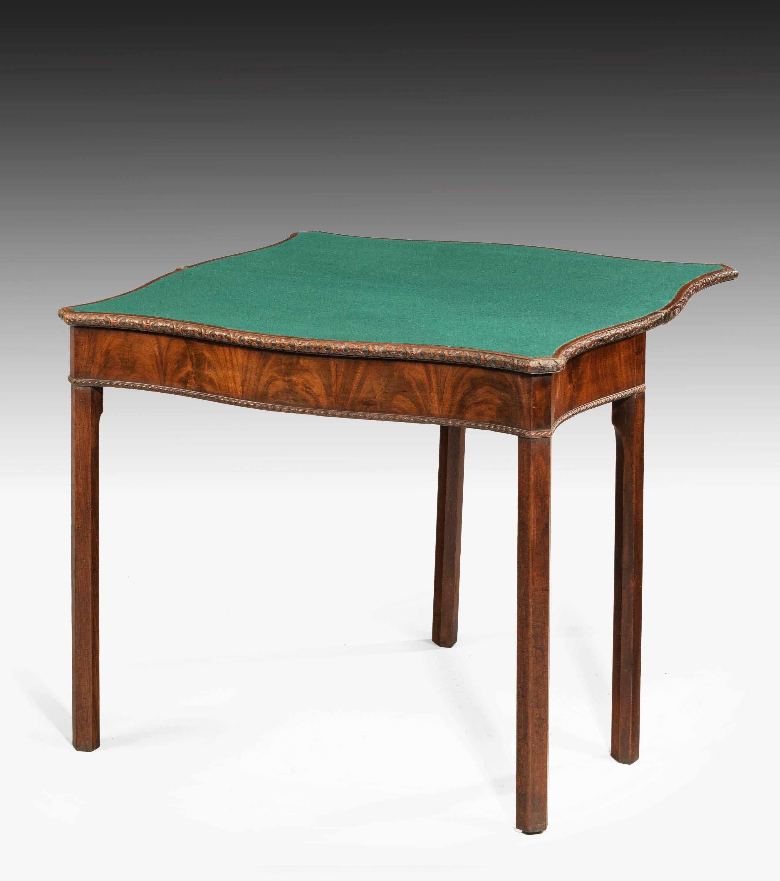 A fine quality Chippendale period card table of serpentine outline. The top continuously carved on square chamfered supports. The front beautifully veneered in book matched timbers. Excellent overall condition.

Open-33 inches.