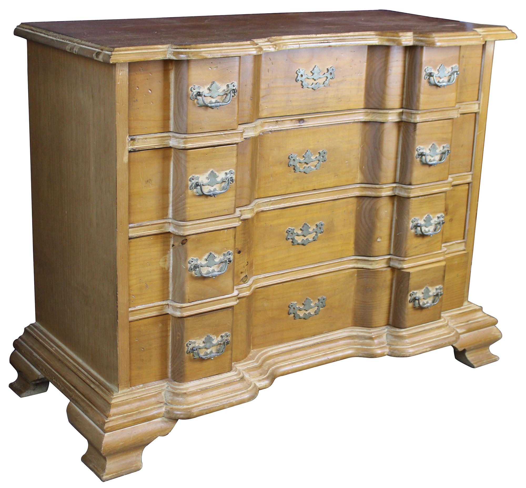 Mid-20th century pine block front chest. Features 4 dovetailed drawers, colonial hardware and bracket feet.  This chest was made for Garcia.  Garcia imported Spanish made artisanal pieces to the states.  
  