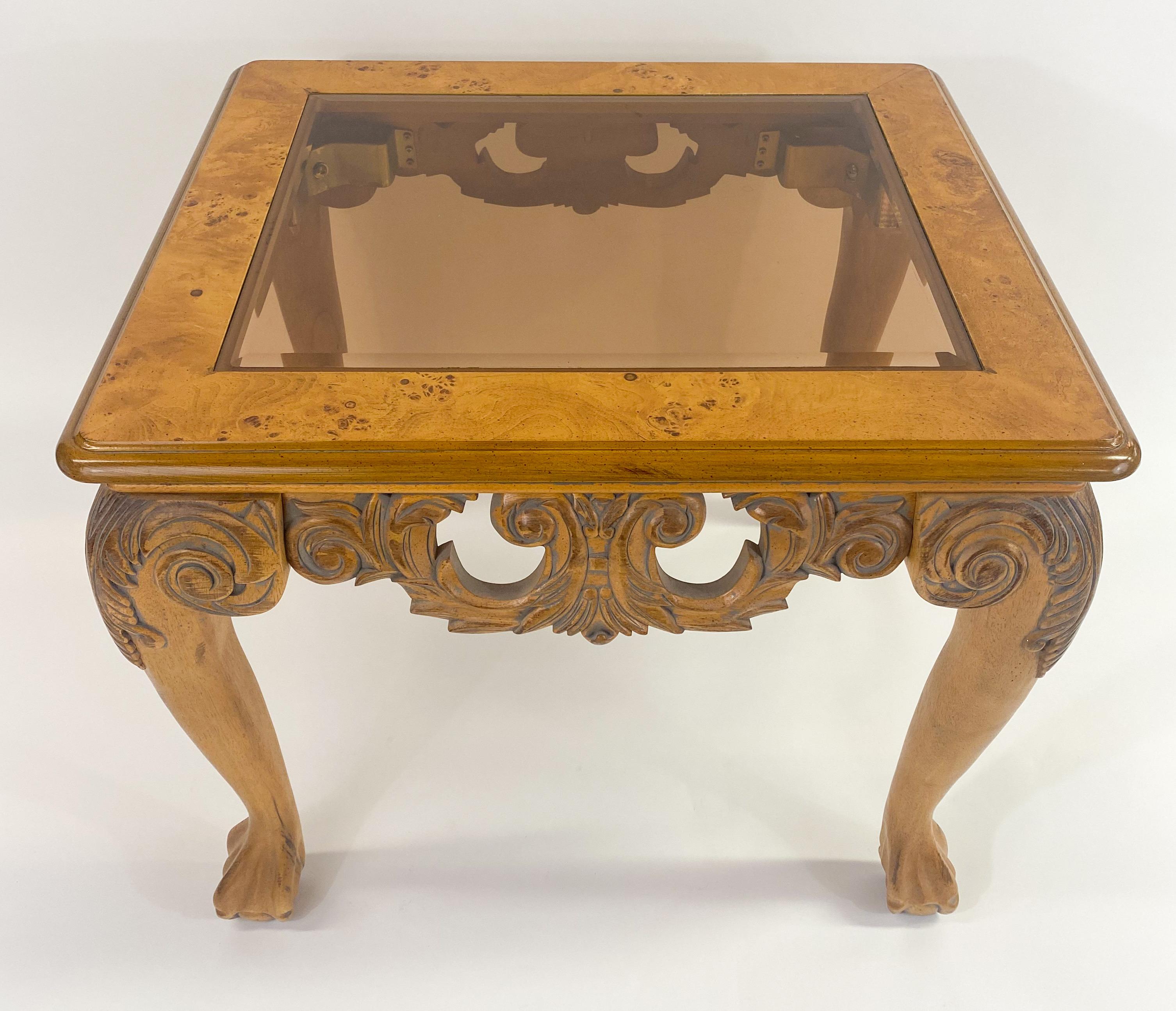 An elegant Chippendale Queen Ann style coffee or cocktail table. The table is finely carved showing beautiful scrolls and leaves design and raised by four cabriole leg with acanthus leaf and scroll design terminating on ball and claw foot. The table