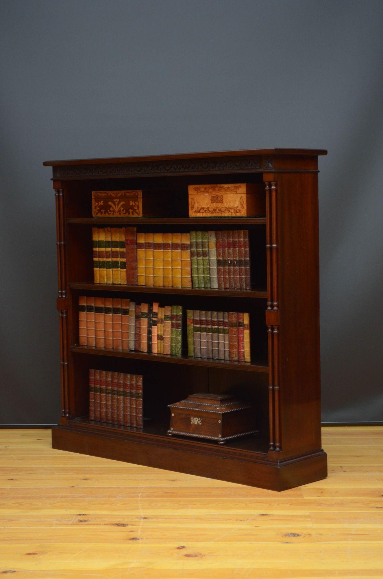 Sn5376 A fine quality Chippendale Revival open bookcase in mahogany, having oversailing top above blind fretwork to the frieze and an open section with three height adjustable shelves, all flamed by slender double columns, standing on moulded plinth