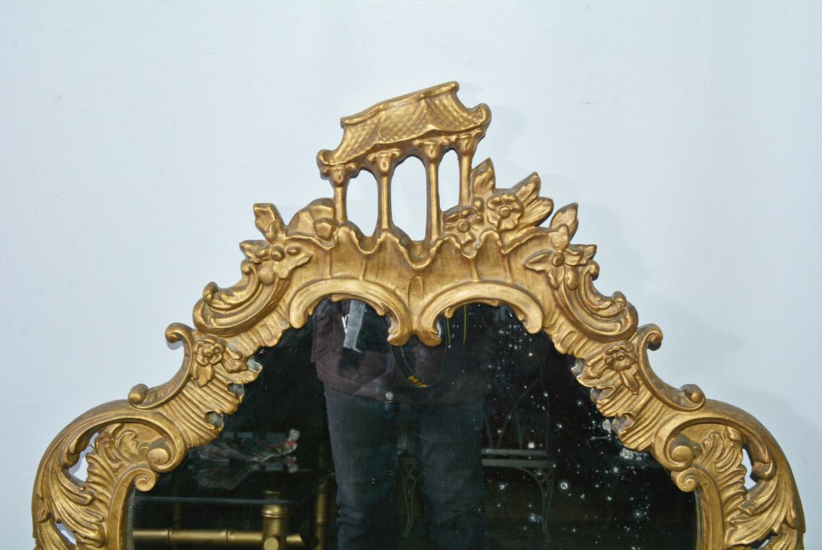 Hand carved Chippendale Rococo style wall mirror in a warm guilt antique finish. Great as dresser, fireplace, mantel or console mirror.