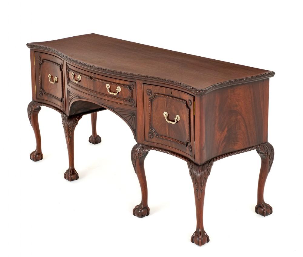 Quality Mahogany Chippendale manner Sideboard.
This Sideboard is Raised Upon Shaped Legs with Boldly Carved Ball and Claw Feet and Carved Acanthus Leaves to the Knees.
Circa 1900
The Sideboard Features a Central Oak Lined Drawer and is Flanked by