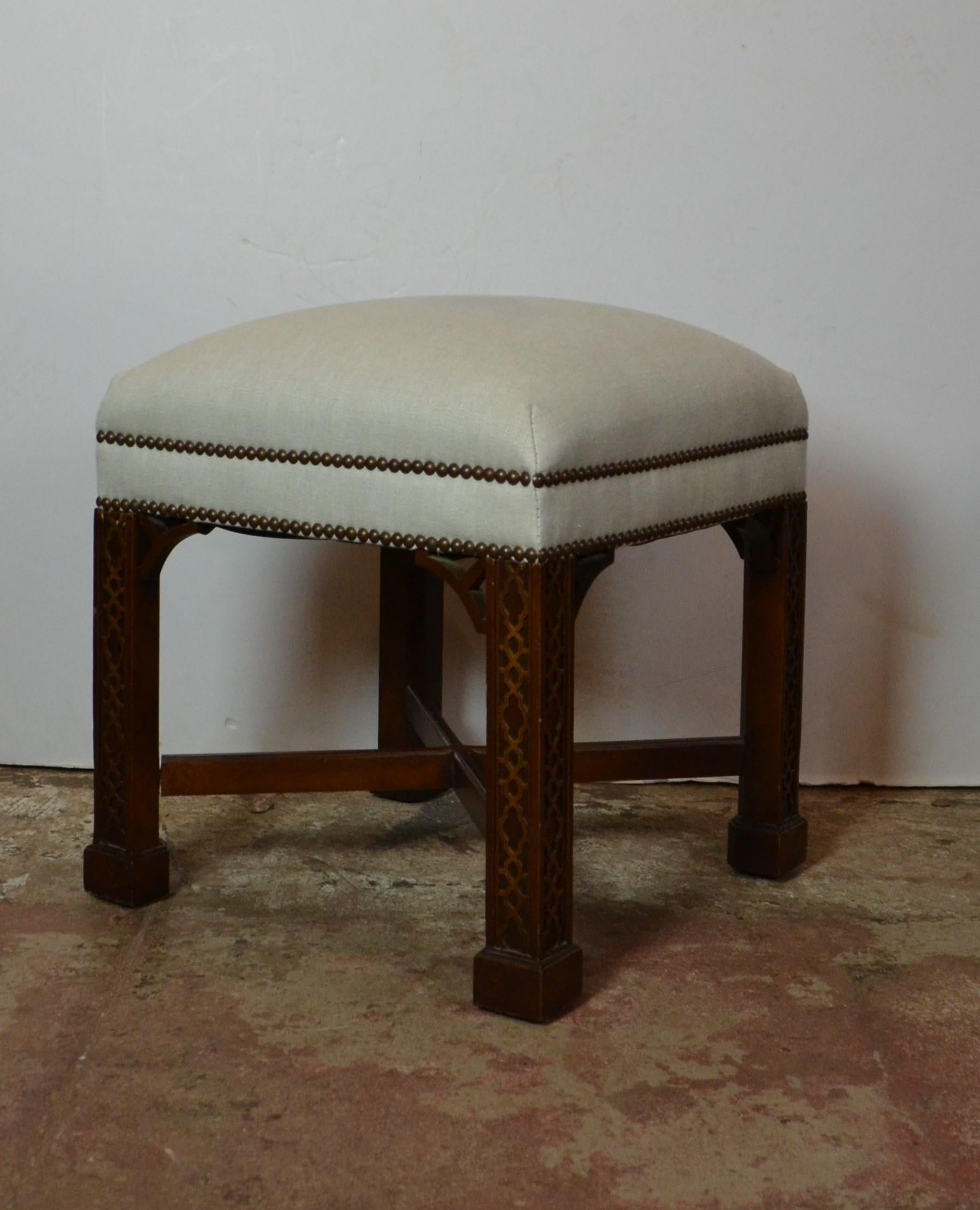 Pair of Chippendale style bench. The frames are mahogany wood and upholstered in linen.