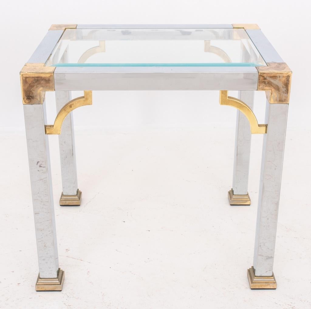 Brass and chrome side table in the Chinese Chippendale manner with arched brackets in brass on a chrome frame, rectangular, with inset glass top above straight square legs.

Dimensions 20