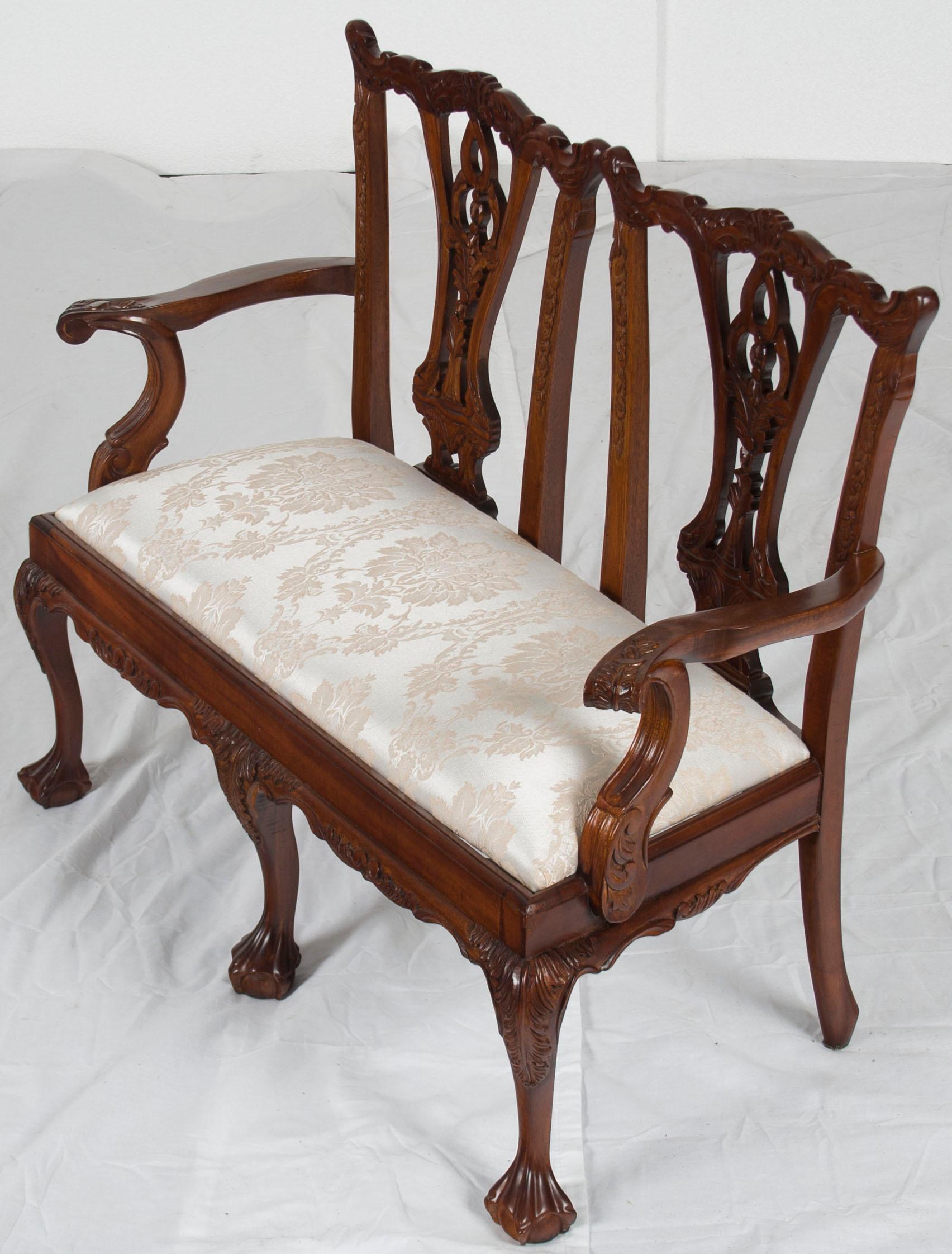 Please read the dimensions of this item carefully, it is child sized!
Done in solid mahogany, this child’s carved mahogany bench has all the charm and elegance of its full sized counterparts, just smaller. Three ball and claw feet are connected