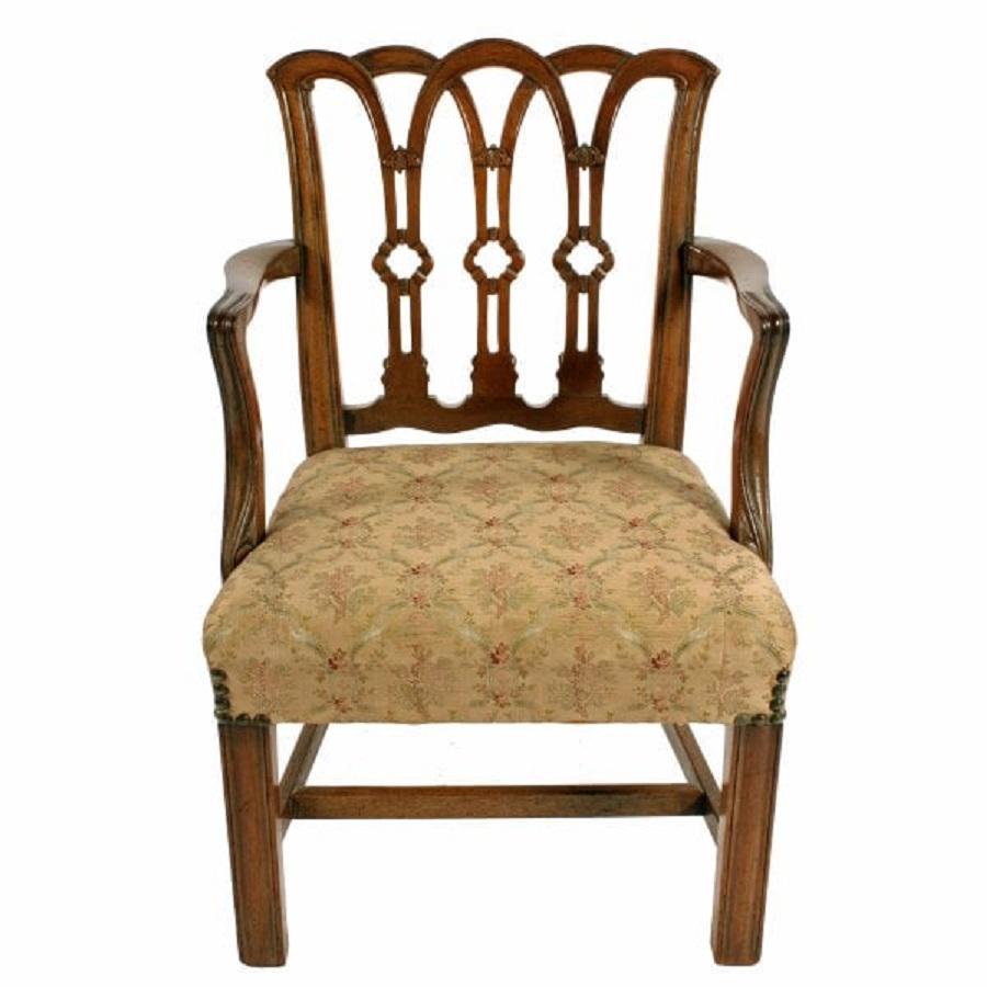A 19th century mahogany Chippendale style child's arm chair.

The chair is a true 18th century design with a carved and shaped multi splatted back and arm supports ending in a scroll.

The square legs are joined by a 'H' shaped cross