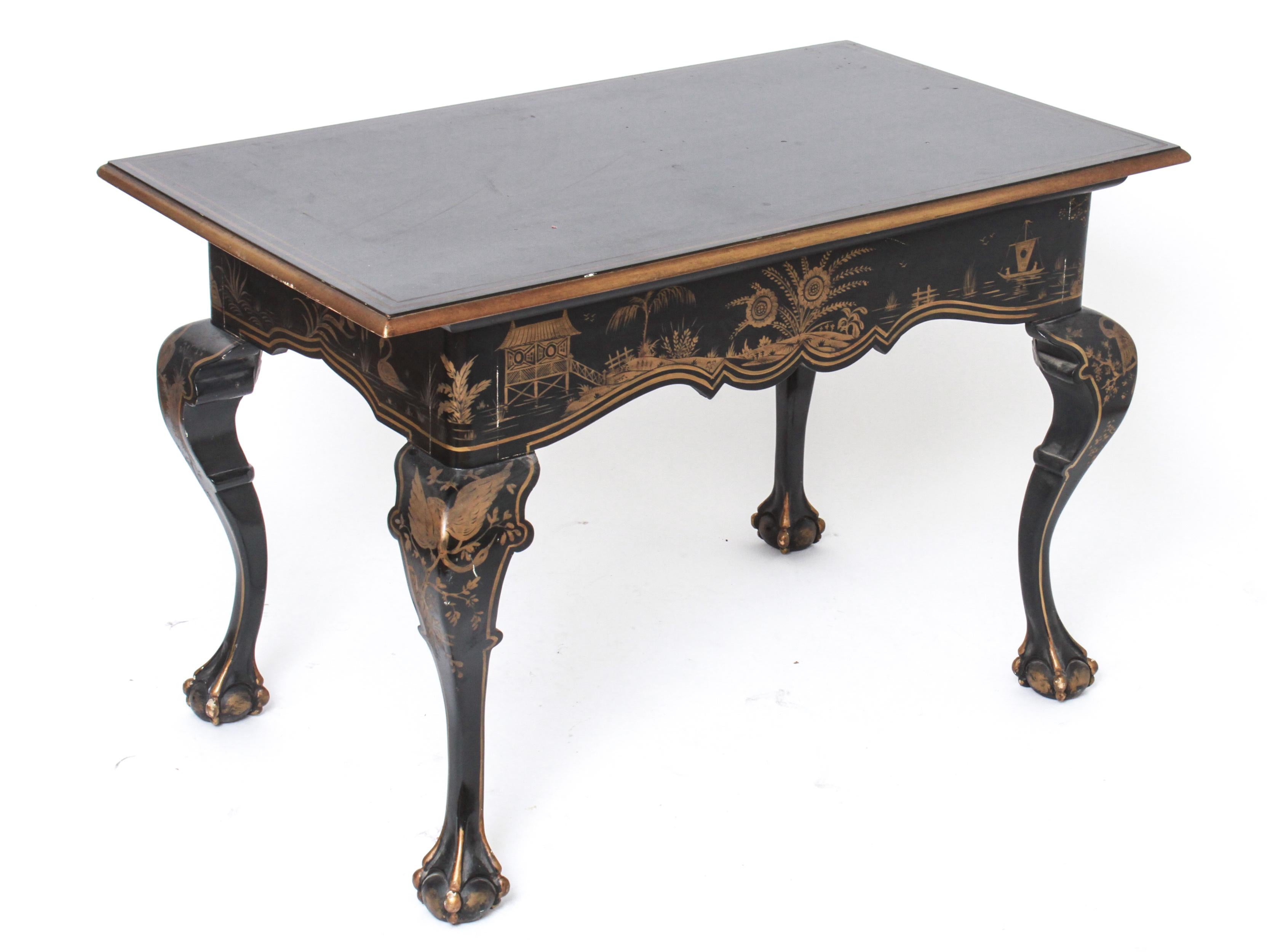 Chippendale style chinoiserie lacquered desk with a rectangular top over three pull drawers. The piece has cabriole legs with ball and claw feet. Some minor flaking and craquelure to the lacquer surface. In great vintage condition with
