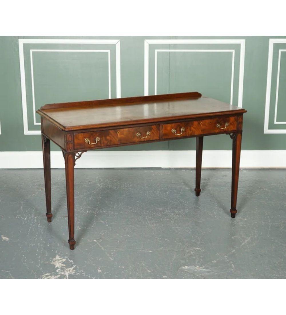 We are delighted to offer for sale this Lovely Chippendale-style Console hallway table.

It serves two drawers with two handles on each drawer. The handles are original and have lovely details on them.

You can see the Chippendale style of