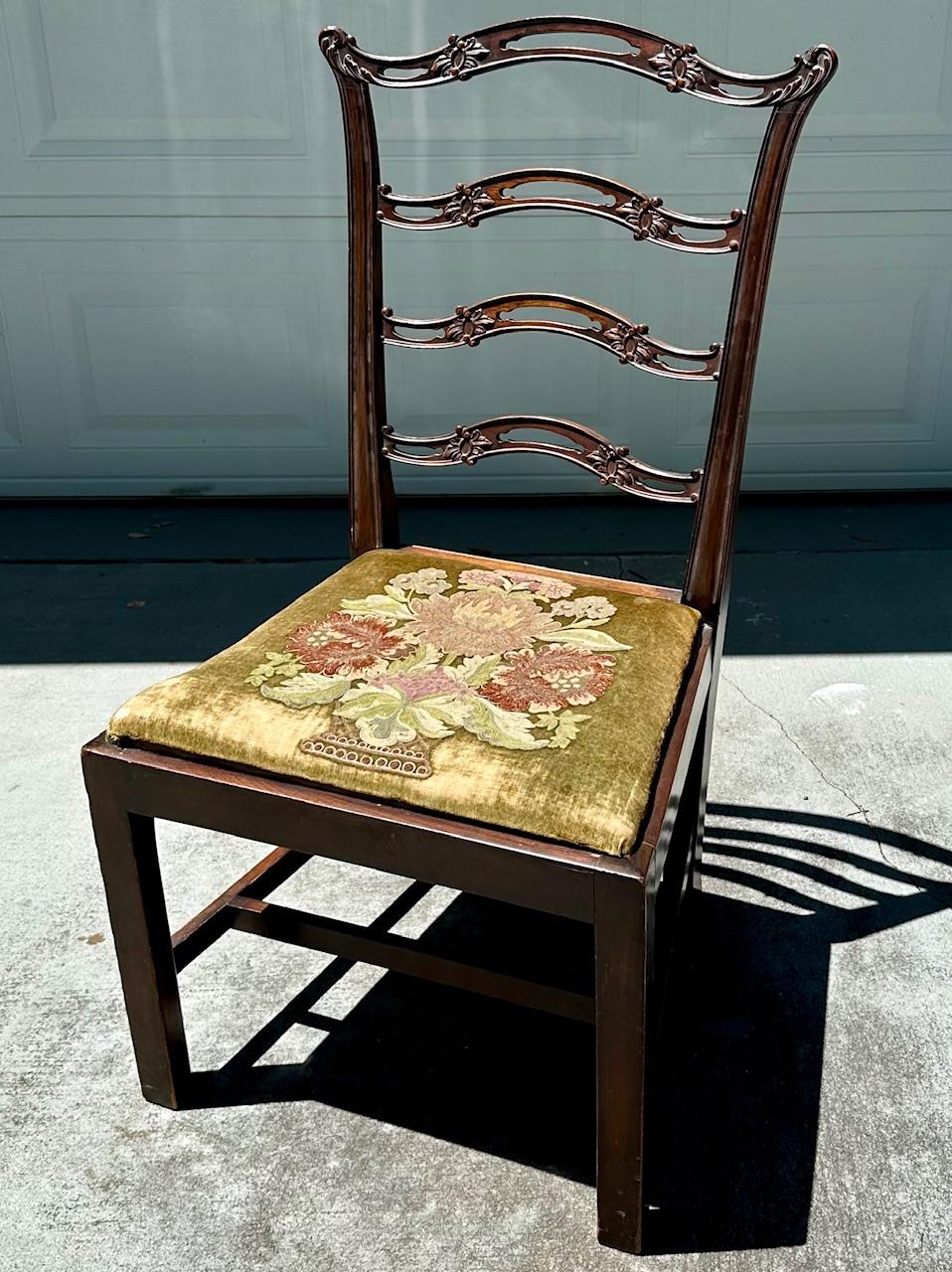 Chippendale Style Ladder Ribbon Back Embroidered Seat Side Chair

This is a superb mahogany, Chippendale ribbon-back side chair with embroidered seat.  Dating to the 19th Century, four interlacing horizontal pierced ribbon splats comprise the ladder