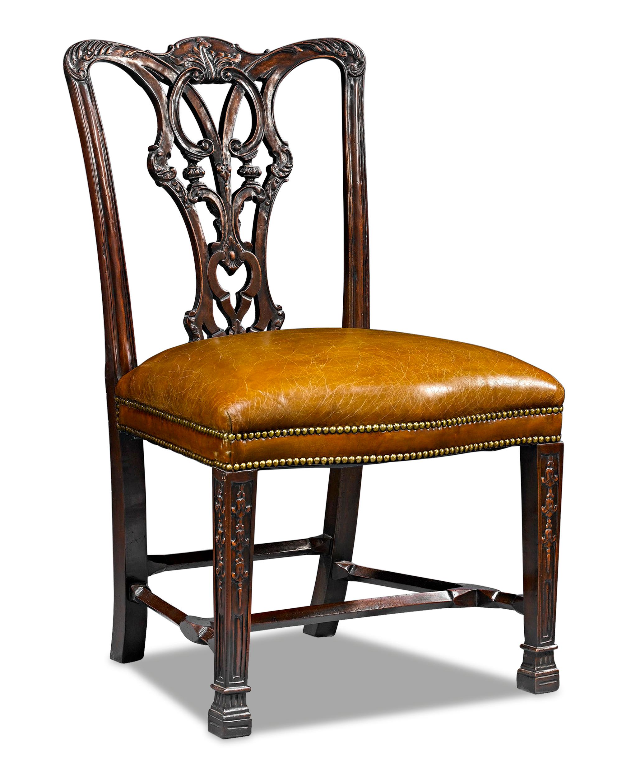 An outstanding set of Chippendale-style dining chairs, created from designs by Thomas Chippendale, one of history's most celebrated artisans. A testimony to the incredible workmanship inspired by Chippendale's example, these chairs not only display