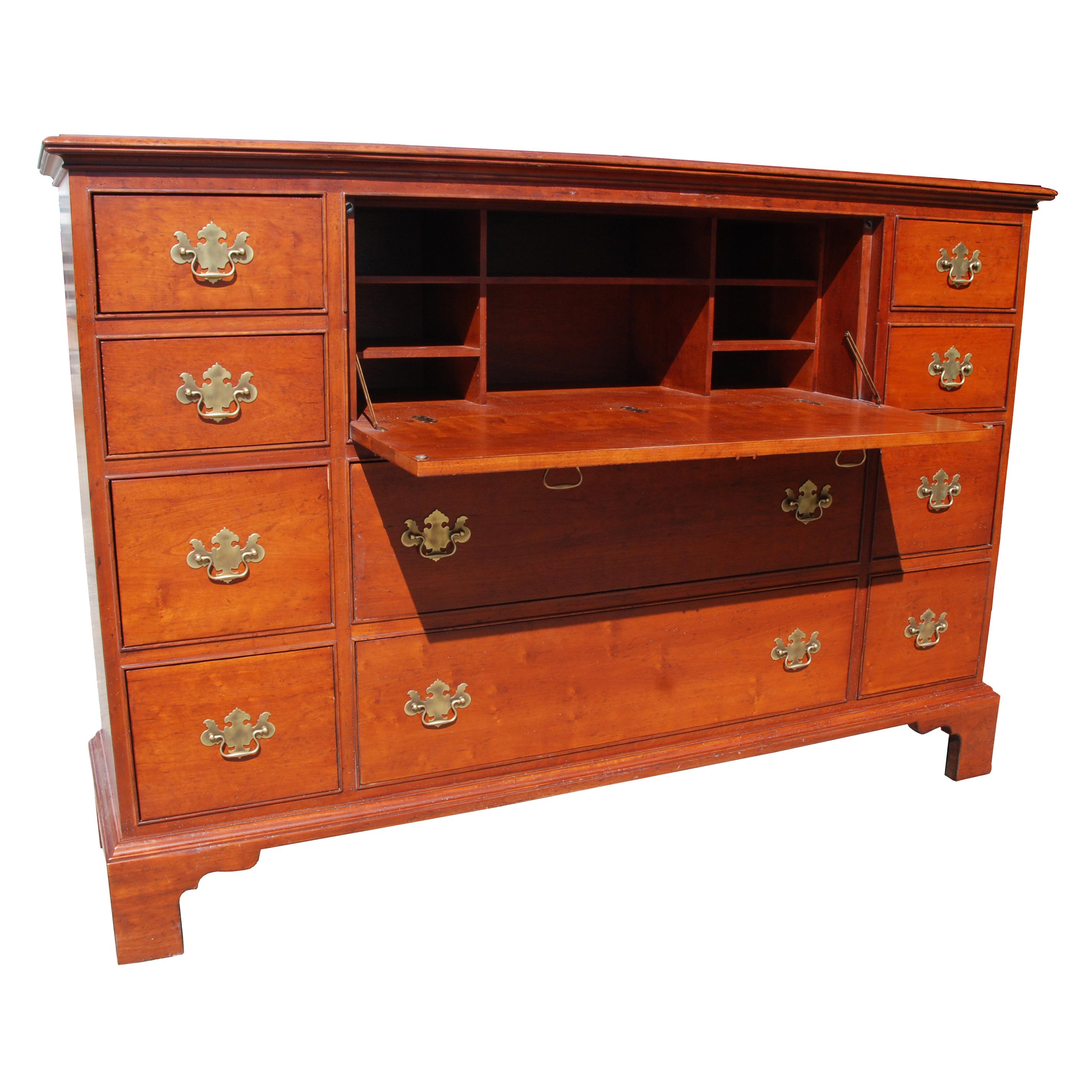 Chippendale style mahogany secretary desk by Milling Street Baker

 10 drawers with brass pulls.
 
Desk has ample storage space, featuring 10 drawers. Middle section opens to work surface.
Includes matching chair.

Includes matching