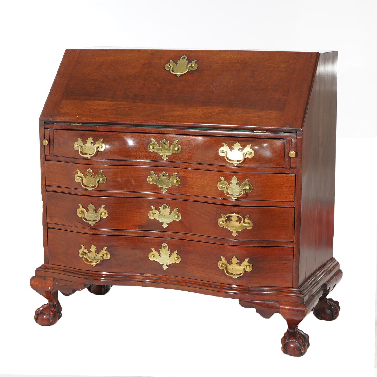 A Chippendale style secretary by Century offers mahogany construction with drop-front desk over serpentine case having four graduated long drawers and raised on claw and ball feet, cast brass pulls throughout, maker label as photographed, 20th