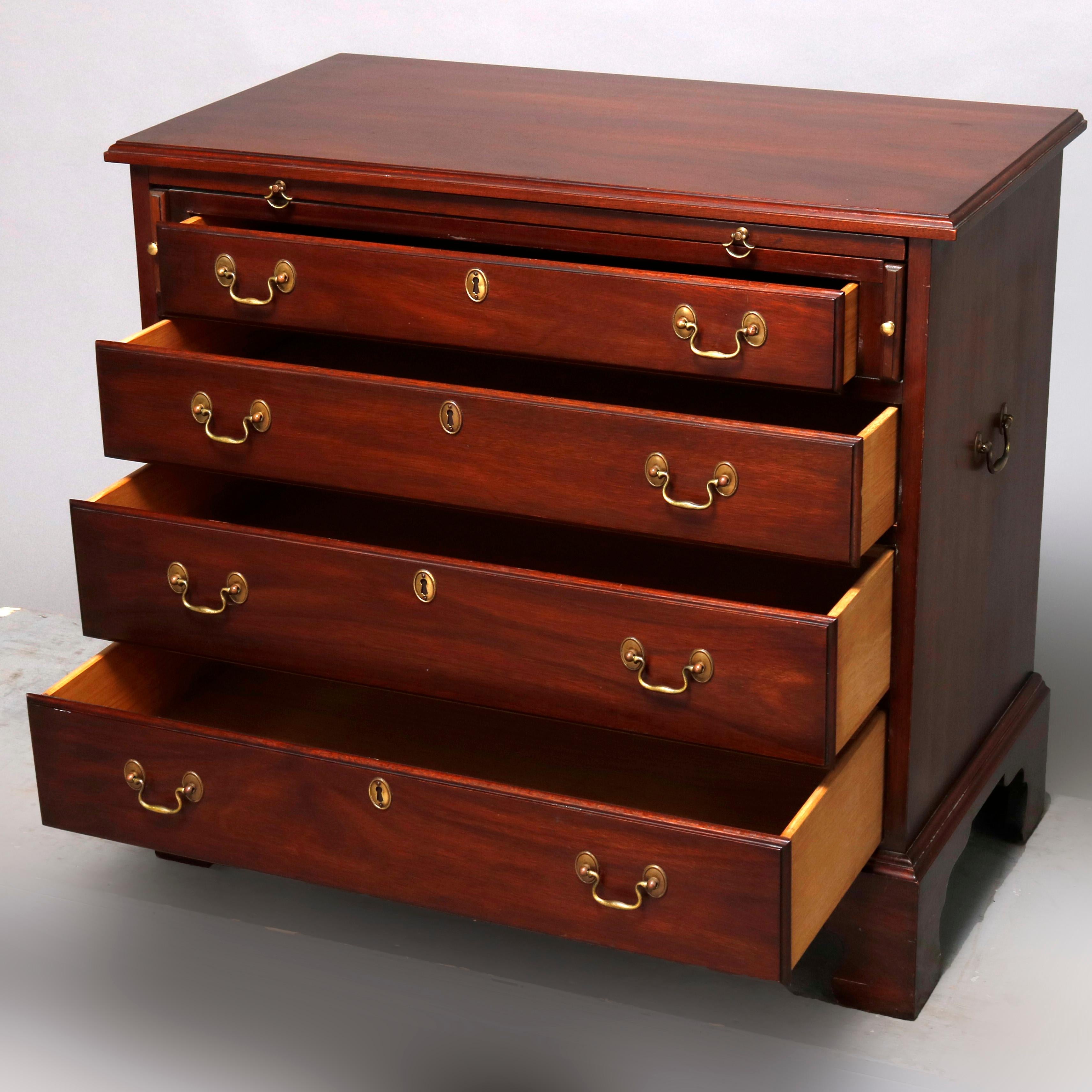 A Chippendale style silver chest by Henkel Harris offers mahogany construction with pull out tray over four graduated long drawers, raised on bracket feet and having cast brass pulls, maker mark on drawer interior as photographed, 20th