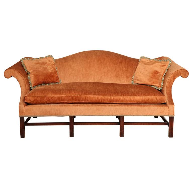 Wonderful Wood & Hogan Chippendale style mahogany sofa with bold scroll arms and accentuated curves on moulded legs. Bench cushion luxuriously filled with 80% goose down - 20% feather.

Upholstered in a high traditional standard as this sofa