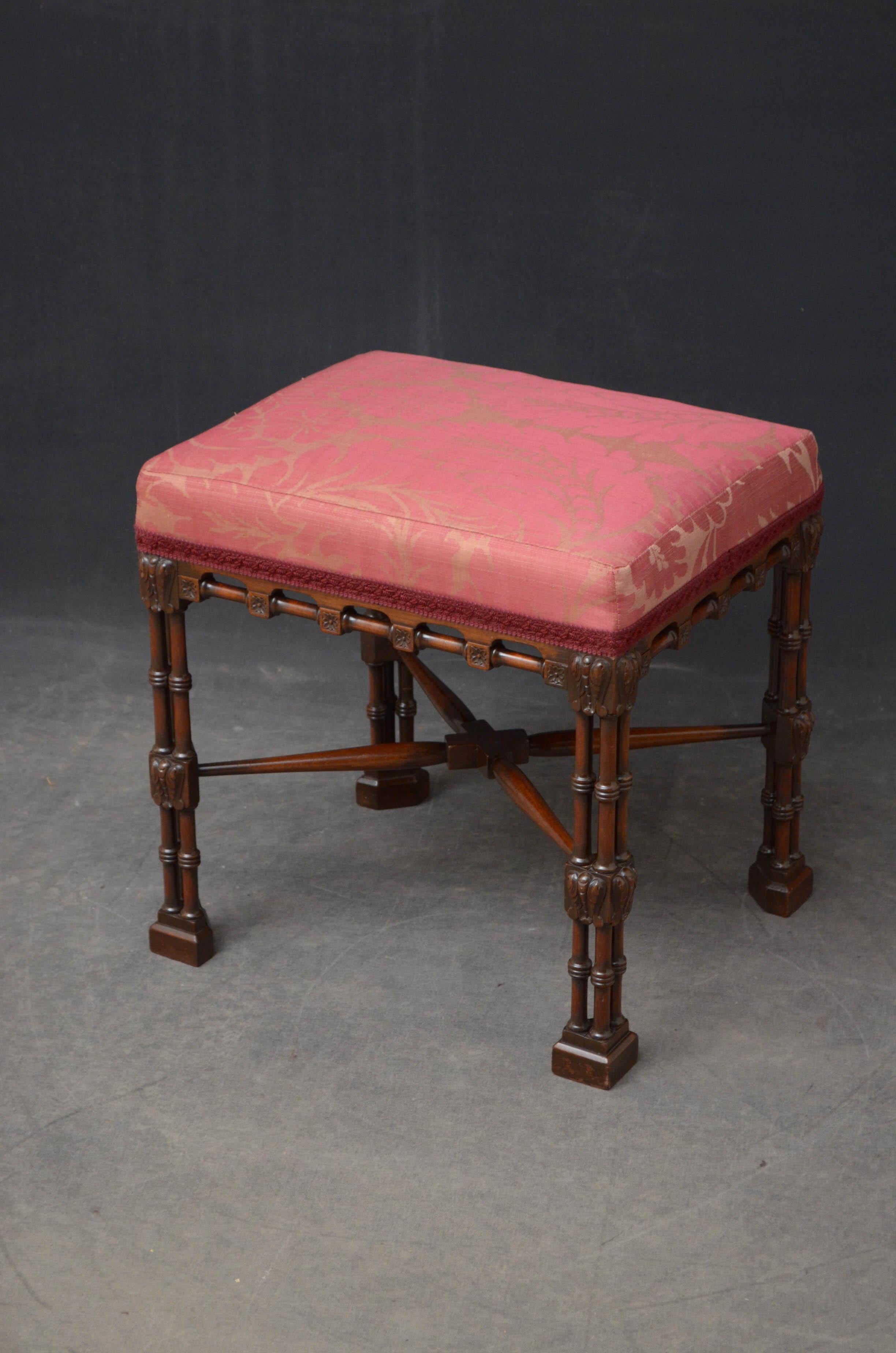 Sn4708 stylish late Victorian Chippendale style stool in mahogany, having rectangular seat with floral pattern fabric above a frieze with flower pateras and turnings, standing on ringed cluster column legs with leafy carvings, all united by turned