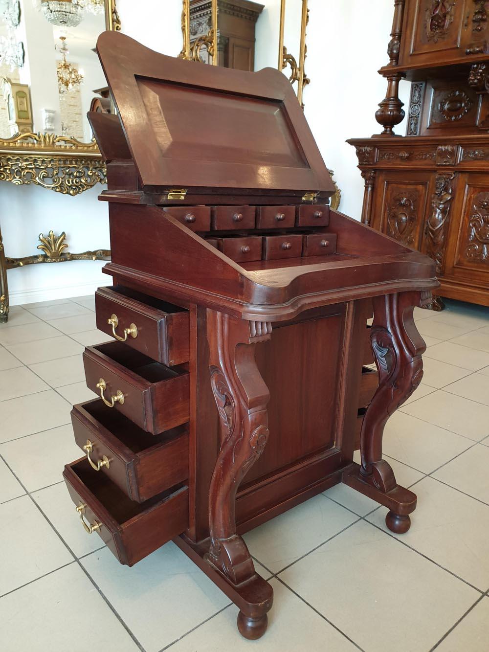 An unusual and very rare mahogany tripartite secretary. Furniture - although small in size - is extremely functional. On both sides of the furniture there are a total of eight drawers, while under the leather lined, raised writing table - another