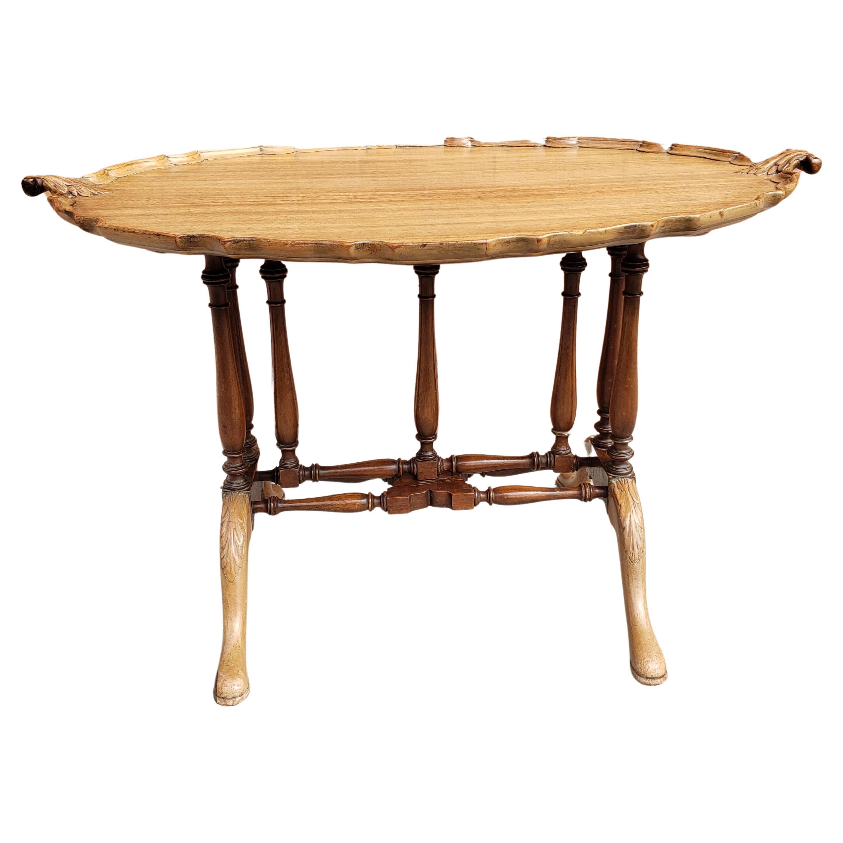 For your consideration is this very unique Pale Sipo Mahogany oval tilt-top pie crust tray tea table in the Chippendale style.
Measures 32.25