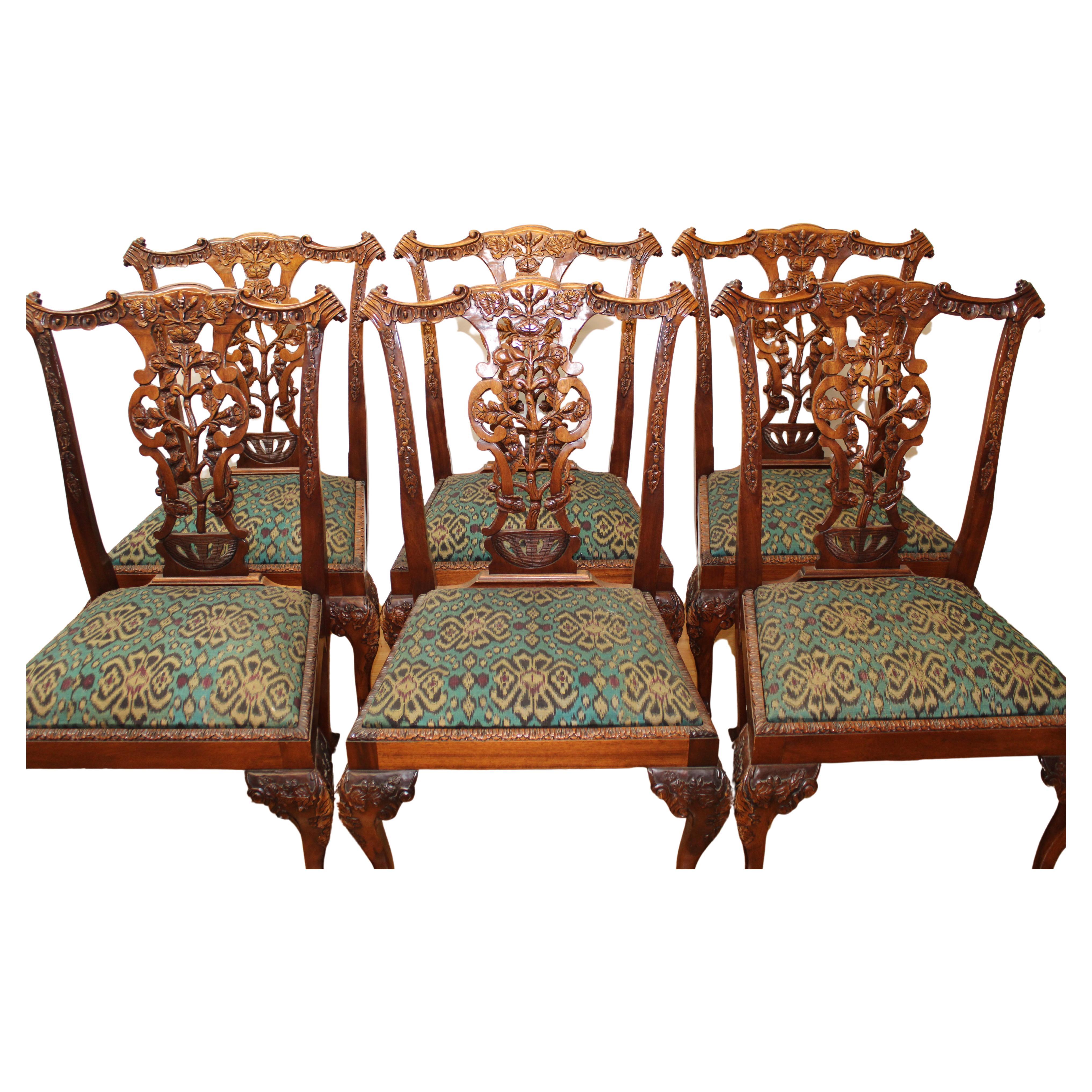 C. early 20th century

Set of 6 Chippendale style side chairs, ornately carved wood w/ acorn & leaf design w/ ball & claw feet.