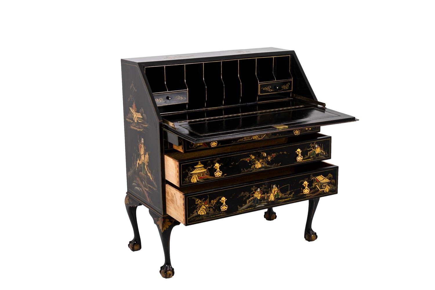 Chippendale style slant top desk in black lacquered wood. Inferior part opening by three drawers with a crossbar. Flap uncovering eight vertical compartments and two horizontal drawers over two horizontal compartments. It stands on four cabriole