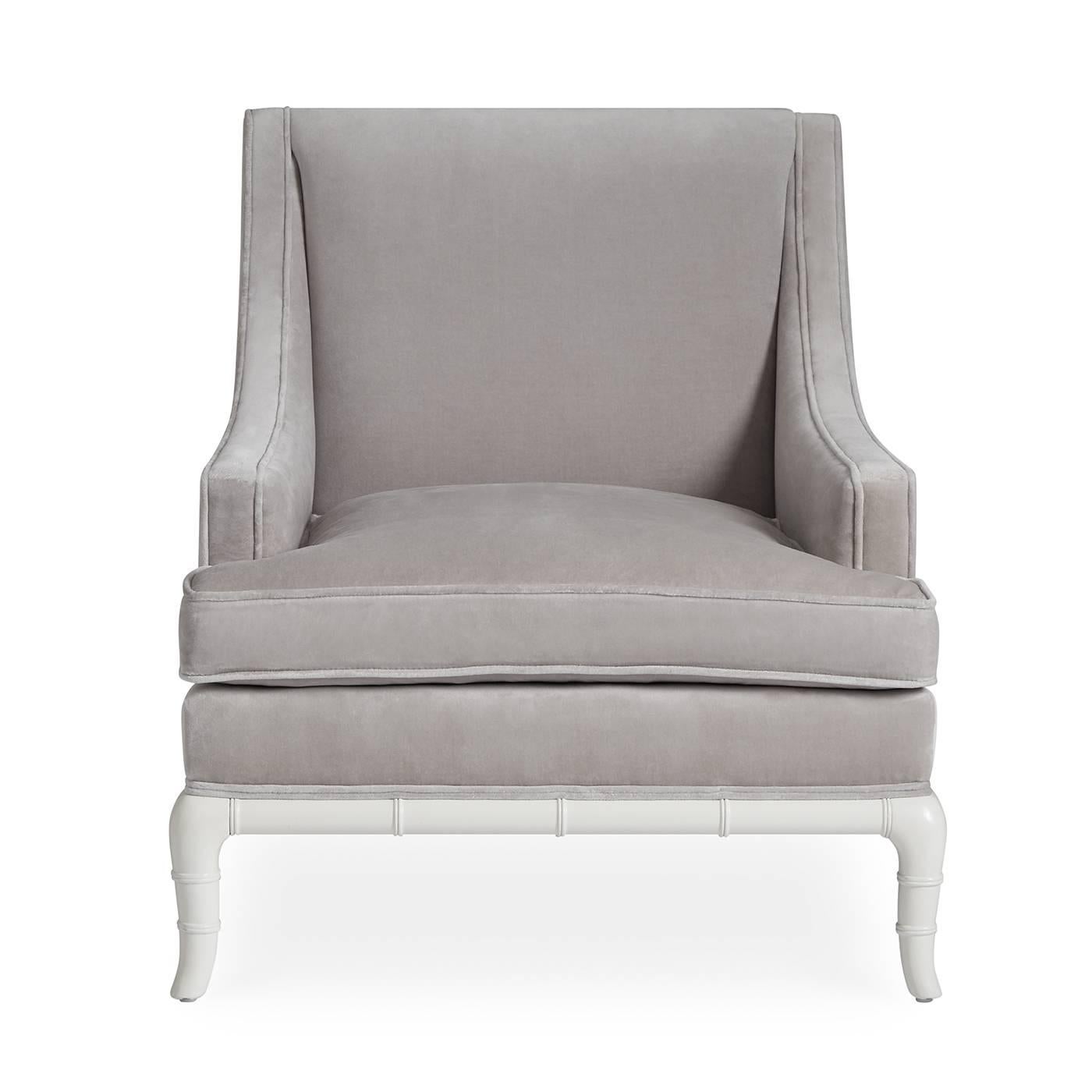 Crisp and classic. Our updated spin on the English club chair with a dash of Chinoiserie. The deep seat and low-slung arms put comfort first, and the glossy white faux bamboo base adds a powerful punch of style. Upholstered in a velvet-blend in the