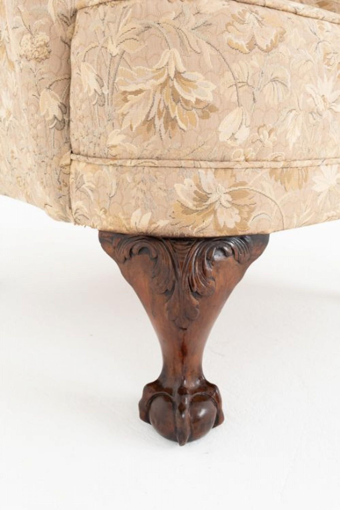 Chippendale style upholstered wing chair.
Circa 1880
This chair is raised upon cabriole front legs with carved knees and well carved ball and claw feet and shaped back legs.
The chair is of a traditional Georgian style with good sized wings a shaped