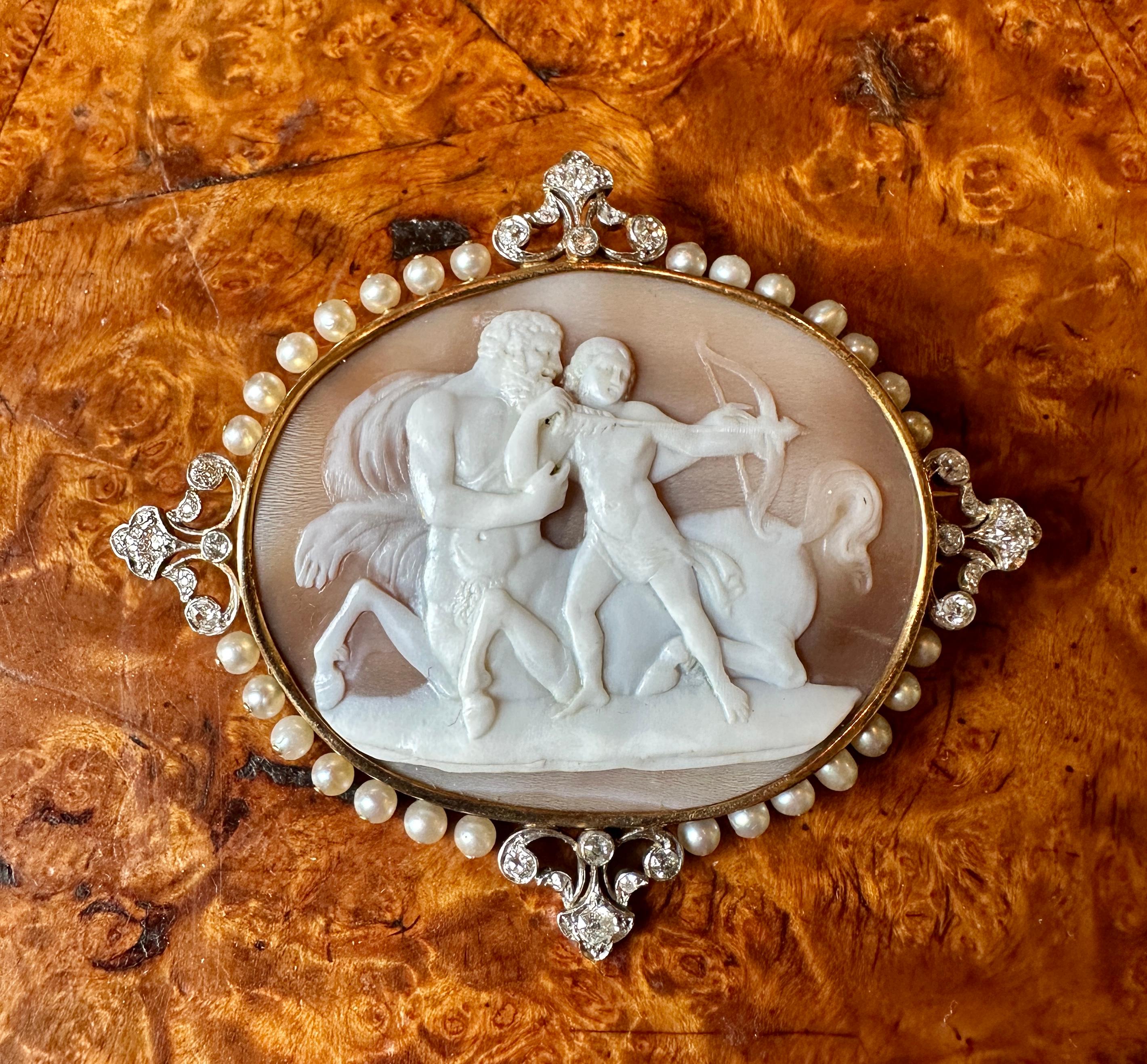 This is one of the most exquisite Antique Victorian - Belle Epoque Diamond Platinum Cameo Brooches we have seen.  The extraordinary cameo is a museum quality jewel.  The hand carved shell cameo depicts the Centaur Chiron and Achilles with his bow