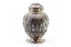 Chiseled and embossed silver pot with garlands, bows, florals, and lid