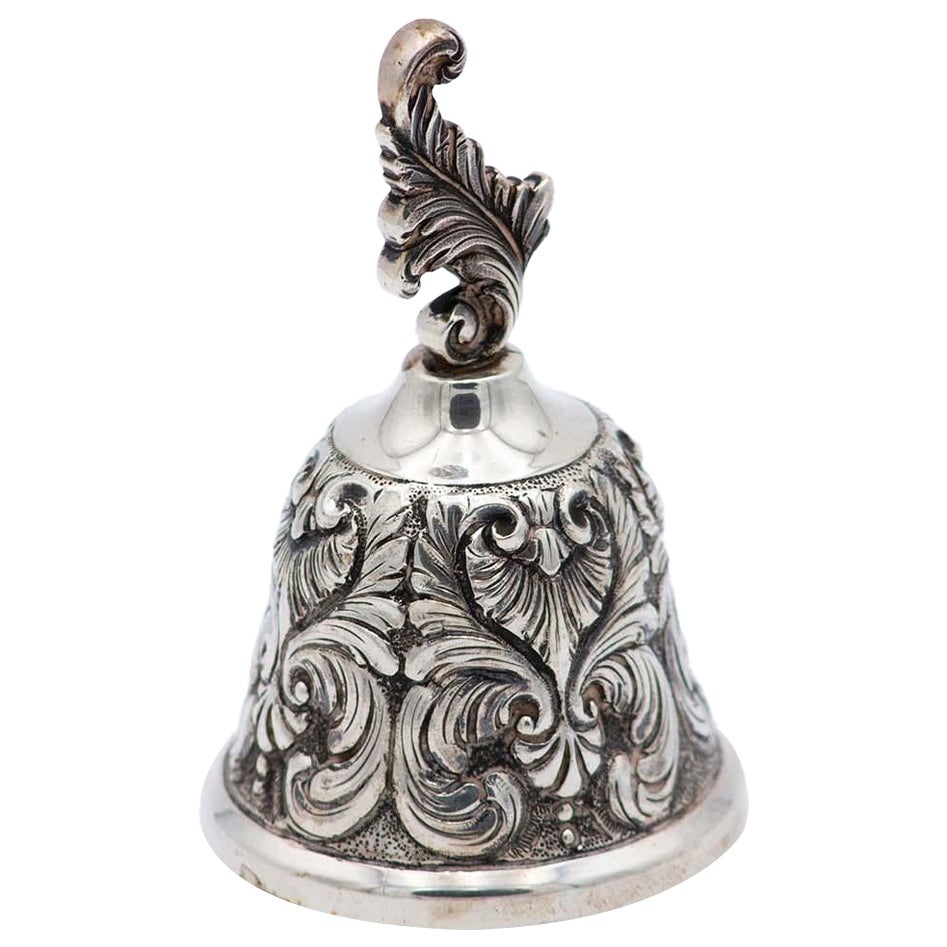 Chiseled silver bell with feathers and plant-based elements For Sale
