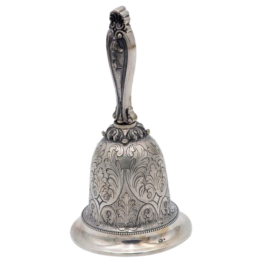 Chiseled silver bell with plant motifs