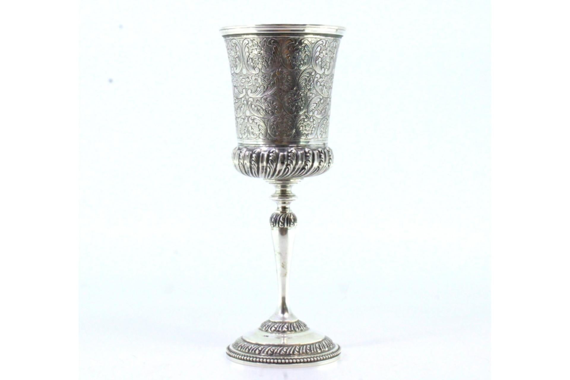 Silver Chiseled silver chalice with reliefs and pearly-frieze base For Sale