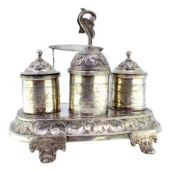 Chiseled silver inkwell with scrolls, acanthus leaves, tanks 
bell