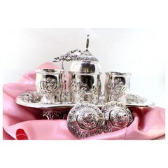 Chiseled silver inkwell with two tanks, bell & four hollow feet