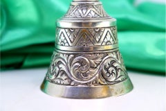 Chiseled silver table bell with nobleman figure as handle