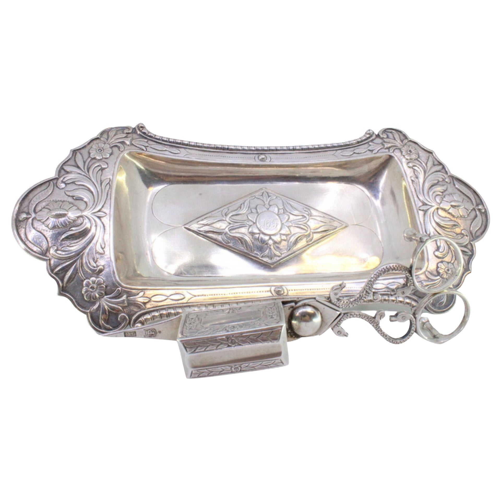 Chiseled silver tray
scissors w/ florals, friezes
4 ball feet