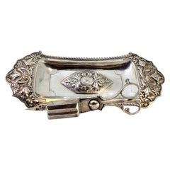 Chiseled silver tray 
scissors w/ florals, friezes 
4 embossed feet