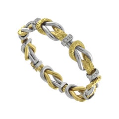 Ziseliertes Knotenarmband aus 18 Karat Gold mit Diamanten - Micheletto