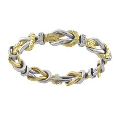 Chiselled Knot Bracelet in Yellow and White 18 Karat Gold with Diamonds
