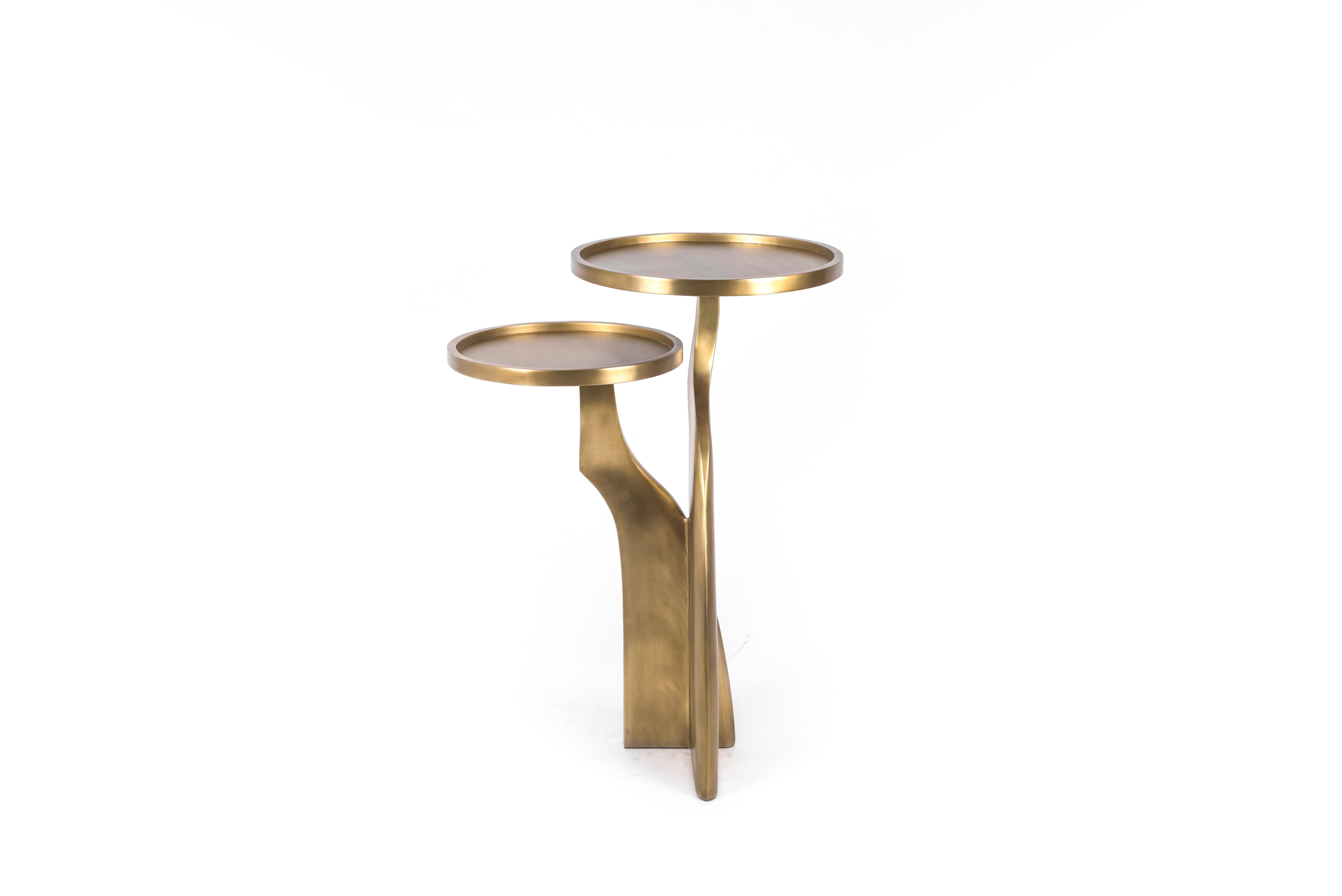 The Chital 2-top side table is both dramatic and organic it’s unique design. The 2-top sits and pair of ethereal and sculptural legs are all fully inlaid in bronze-patina brass. This piece makes for the perfect end table and is originally inspired