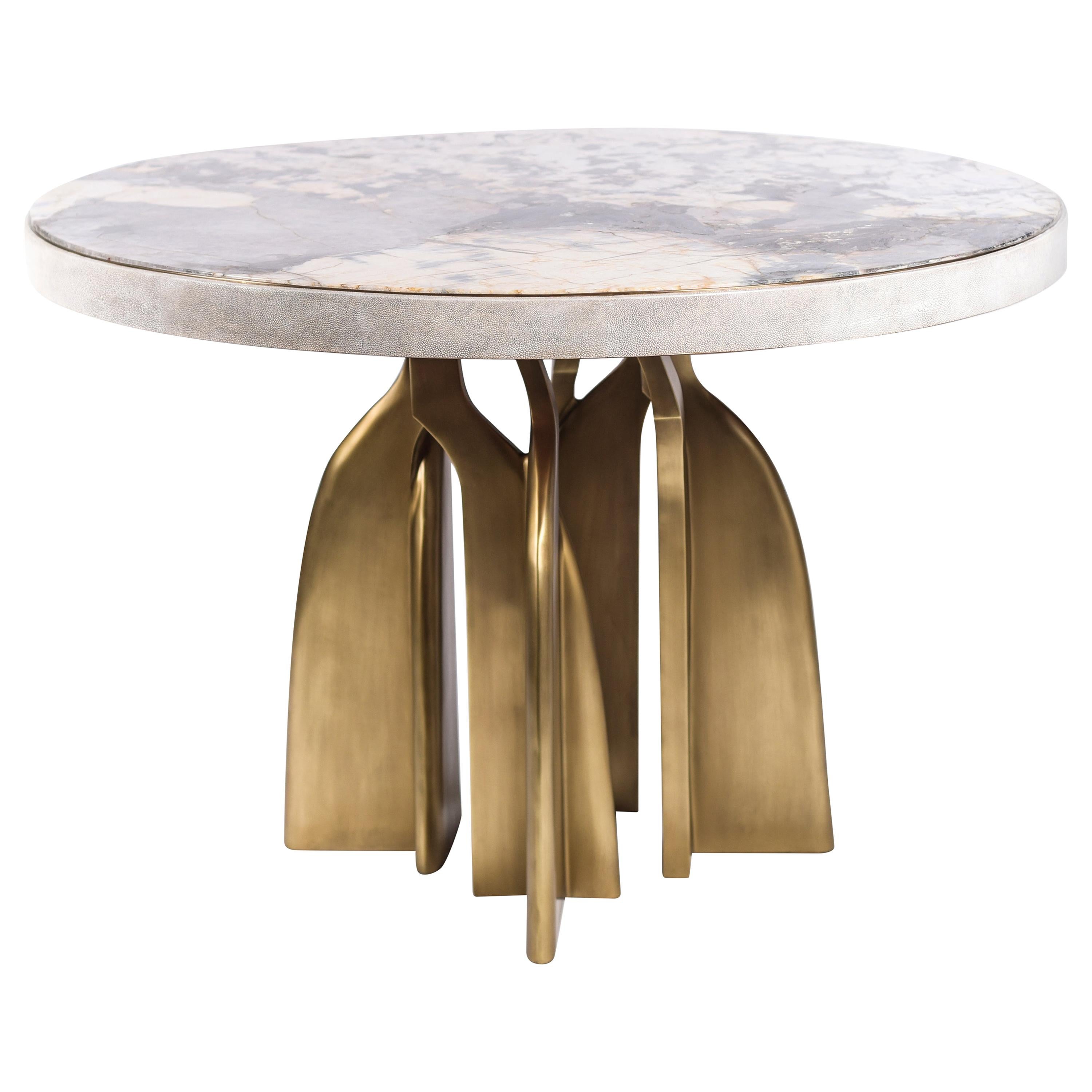 The Chital breakfast table is a stunning piece, a statement in any space. The onyx stone inlaid top is stunning and one of a kind. The semi-precious stone has beautiful color tonalities and silver inserts. The side border of the top is inlaid in