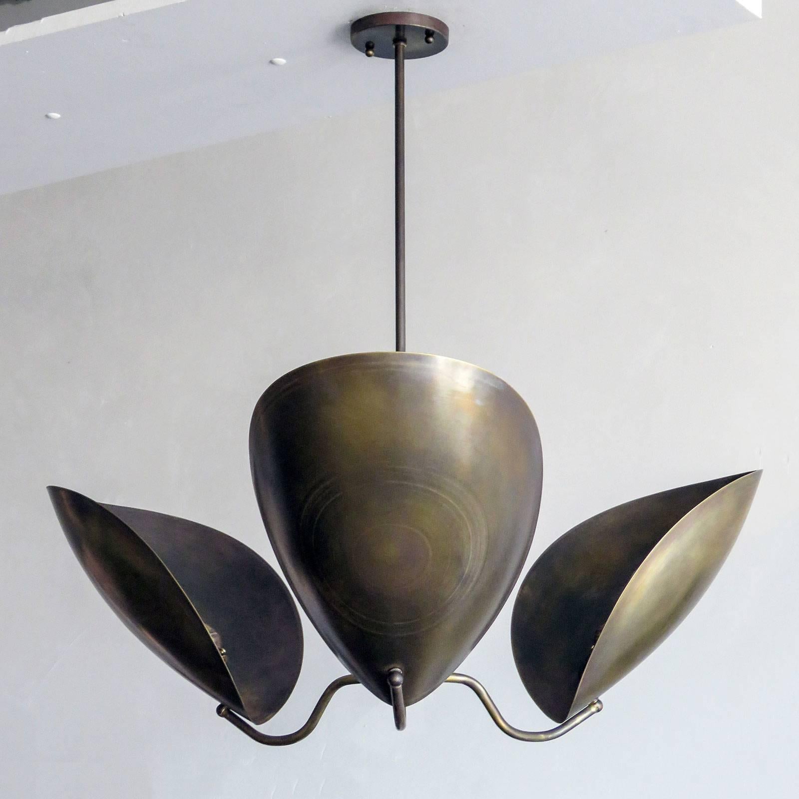 Elegant three shield chandelier 'Chiton-3' designed by Gallery L7, handcrafted and finished in Los Angeles from American brass. Reminiscent of stag beetle armor, in a raw brass finish, overall height can be customized ( 20in + ). Three E26 sockets