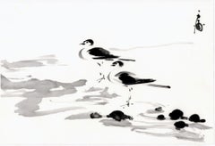 Peinture à l'encre de deux oiseaux de chasse sur la plage