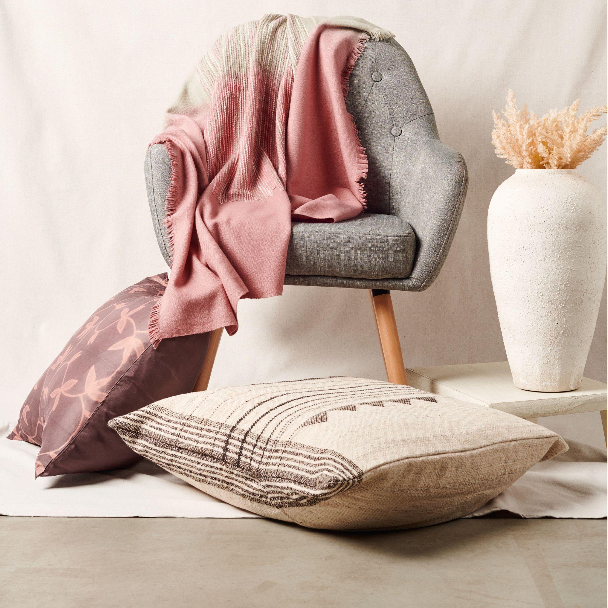 Chive Throw is a pure modern take on combining shape, sombre color palette and fine detail of hand embroidery done meticulously on a handwoven textile. Each piece is 100% handmade making it a unique sustainable throw which is both classic and