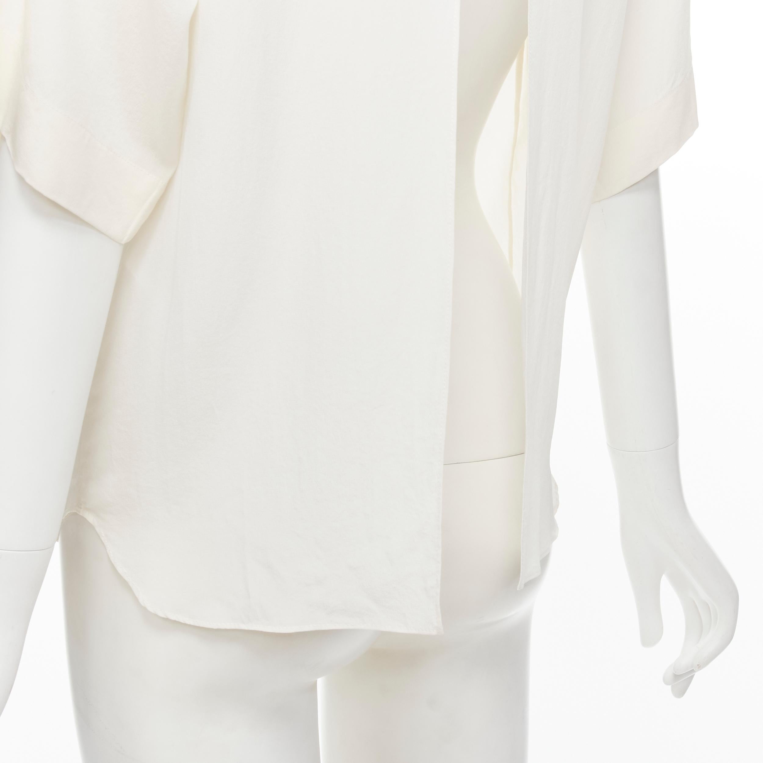 CHLOE 100% silk milk white split open back short sleeve top FR34 XS 
Reference: LNKO/A01876 
Brand: Chloe 
Material: Silk 
Color: White 
Pattern: Solid 
Closure: Hook & Eye 
Extra Detail: Single hook & eye closure at back of neck. 
Made in: