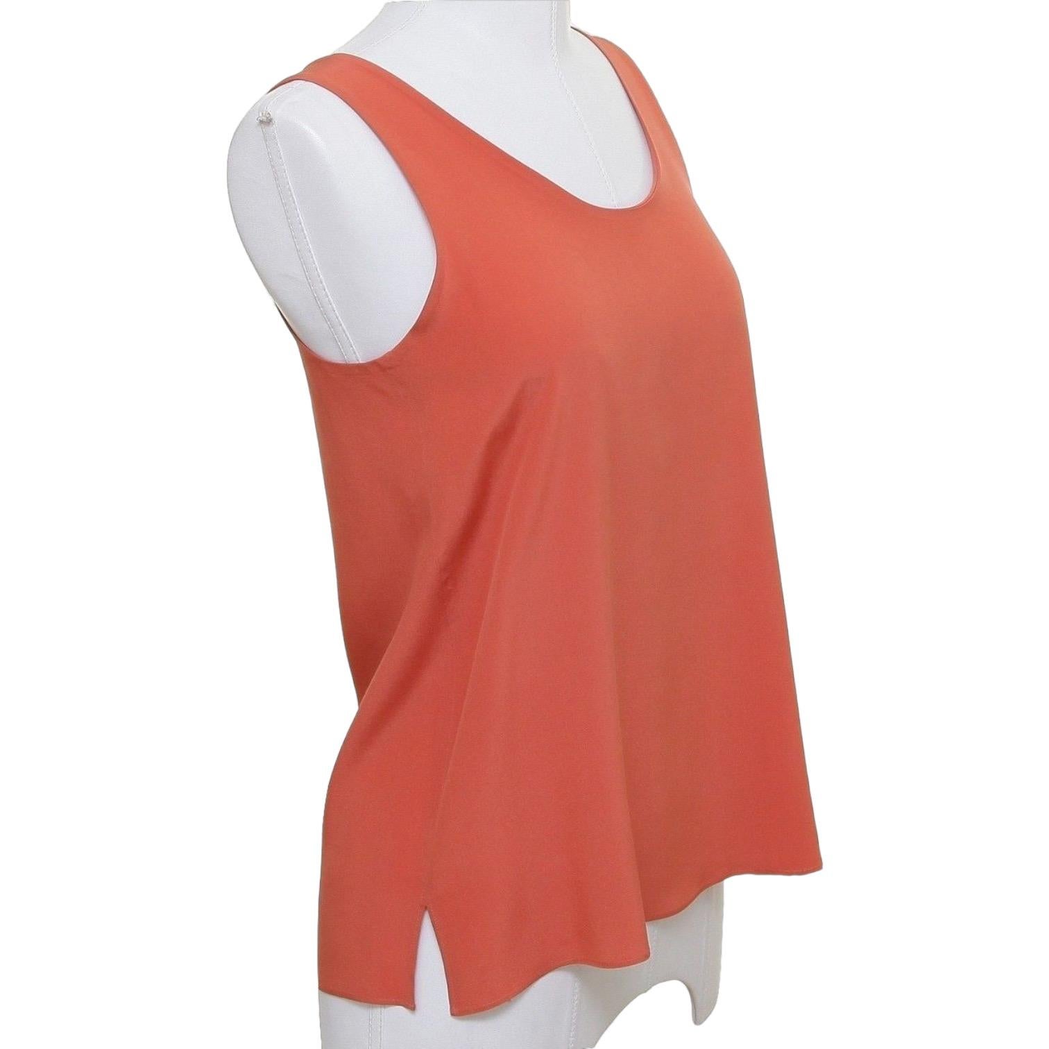 GUARANTEED AUTHENTIC BEAUTIFUL & TIMELESS CHLOE SILK BLOUSE
Looks great with jeans or under a jacket!

• Design:
  - Beautiful orange colored sleeveless blouse.
  - Rounded neckline, slip on.
  - Unlined, very lightweight and elegant.
• Size: 34
•