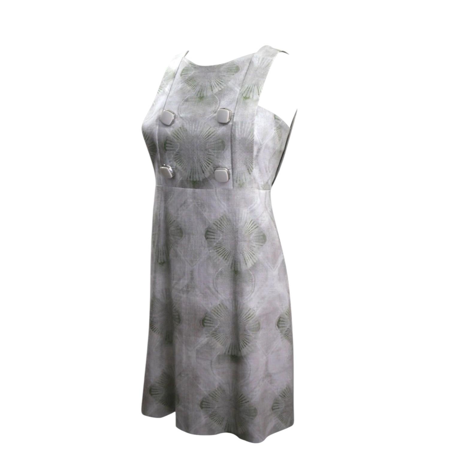 GUARANTEED AUTHENTIC CHLOE 2007 COLLECTION SHIFT A-LINE DRESS DRESS, COLLECTOR'S PIECE
SEIZE THE OPPORTUNITY TO GET THIS STUNNING DRESS

MATERIAL:
 • Cotton blend
 • Polished silver-tone hardware + resin

COLOR:
 • Multi-color, greys + greens
 • EAU