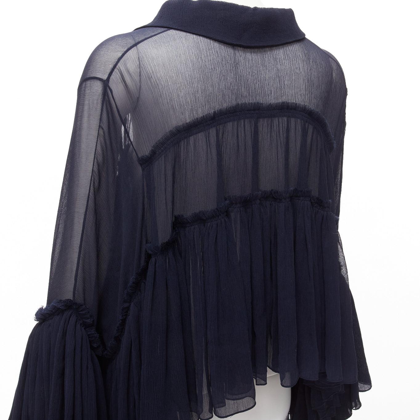 CHLOE 2015 Runway navy silk chiffon voluminous ruffle sleeve tie neck collared boho blouse
Reference: NILI/A00041
Brand: Chloe
Collection: 2015 - Runway
Material: Silk
Color: Navy
Pattern: Solid
Closure: Tie Neck
Extra Details: The most wonderful,
