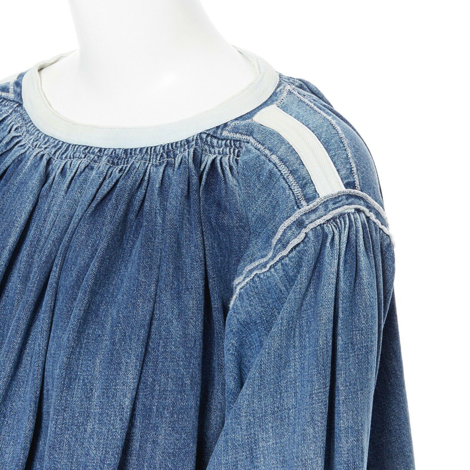 CHLOE 2016 blue denim blouse a-line baby doll top smocked frayed bohemian FR36 S

Designer: CHLOE BY CLARE WAIGHT KELLER
Model / Season: 2016
Material: cotton
Color: blue
Pattern: plain
Description: Mid-weight denim blouse. A-line silhouette.