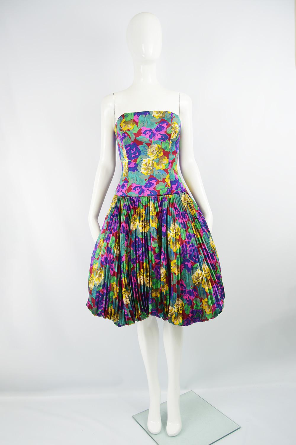 A stunning vintage evening dress by Chloé from autumn winter 1988 as seen in the runway collection. In a floral print silk with a strapless, boned bodice and an accordion pleated bubble hem skirt. 

Size: Not indicated; fits like a UK 10/ US 6/ EU