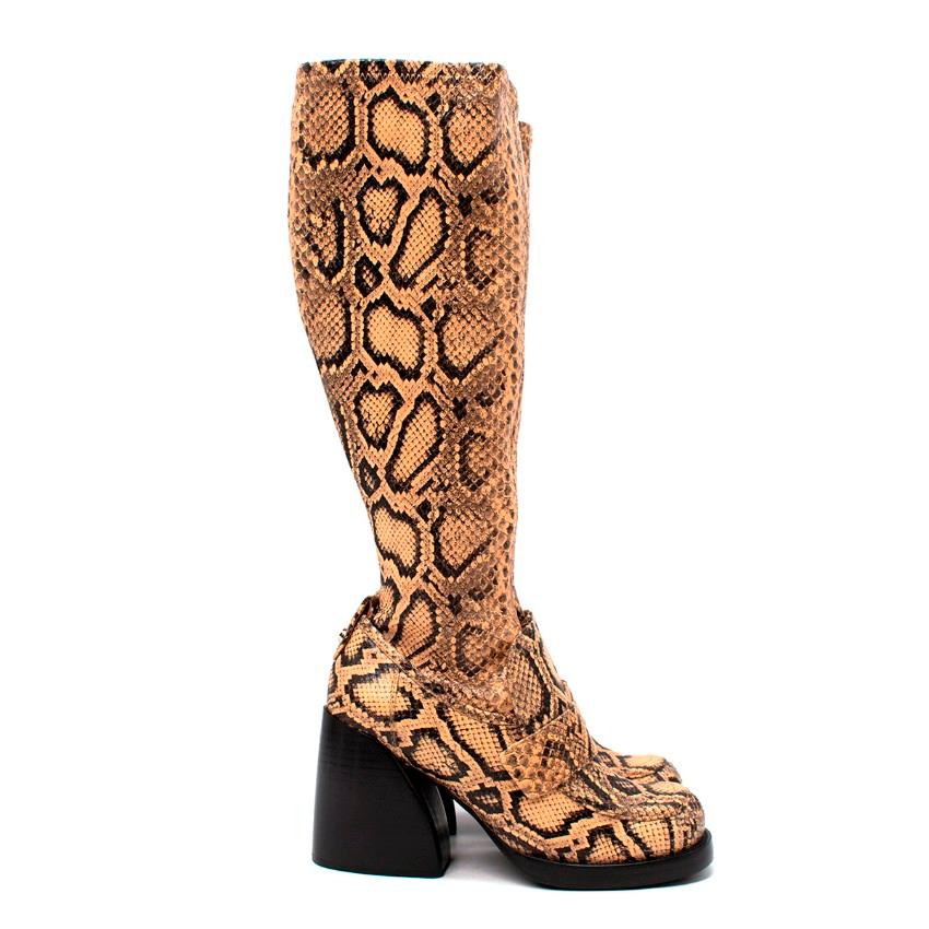 Adelie Python-Effect Leather Heeled Knee High Boots

- Pre AW19 Look
- Beige and black snake-effect leather 
- Feature a high block heel
- Side zip fastening
- Round toe
- Loafer detail
- Gold-tone metal hardware

Materials:
Leather

Made in