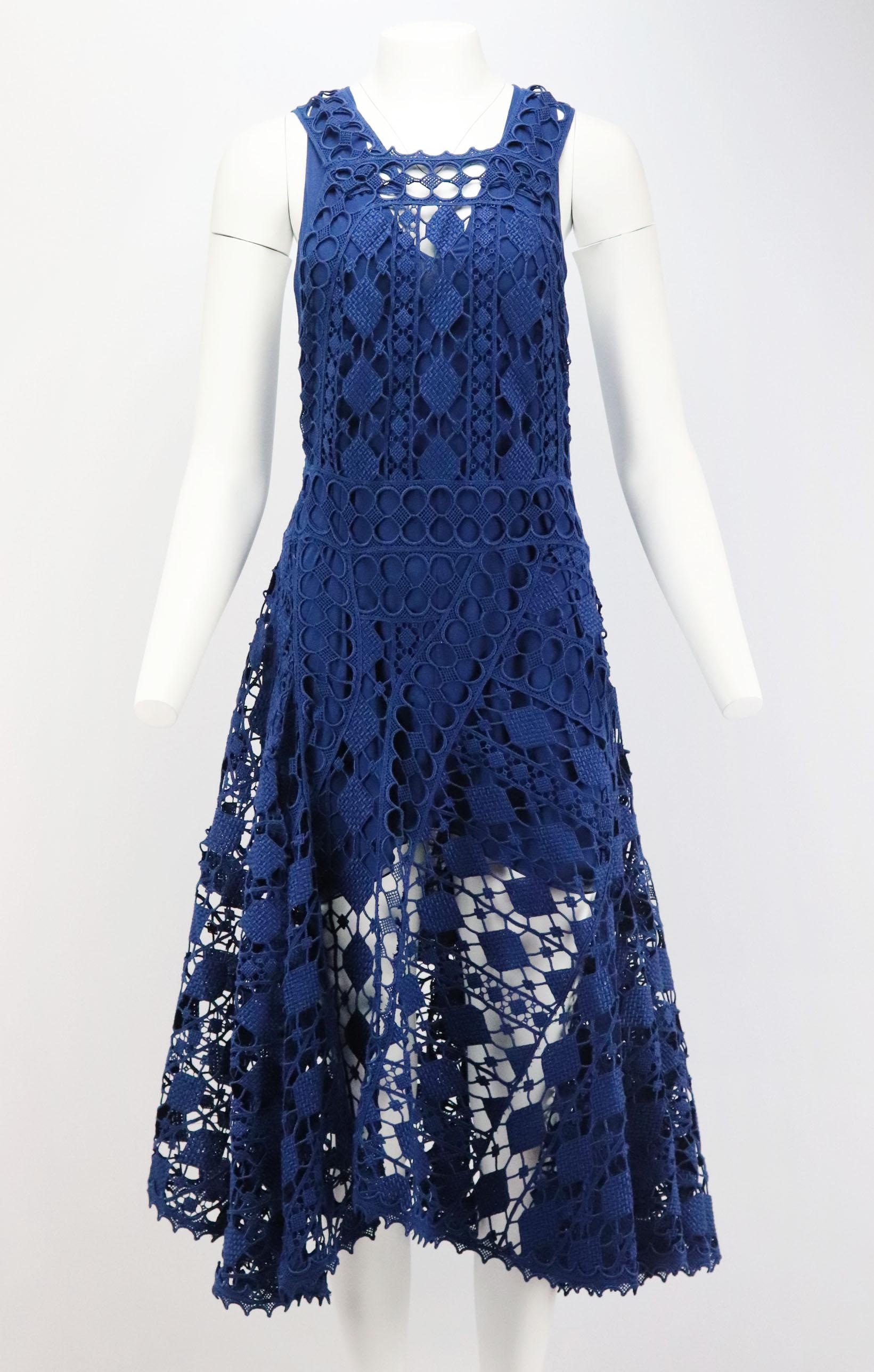 If you're looking for a dress that truly makes a lasting impression, this blue Spring 2014 Runway dress by Chloe has to be top of your list, it's cut from crocheted lace that falls to an asymmetric hem and cutout detail at the back.
Blue crocheted